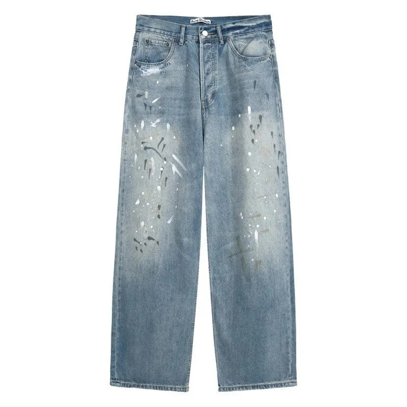 Acne Studios — jeansy; efekt rozprysków farby